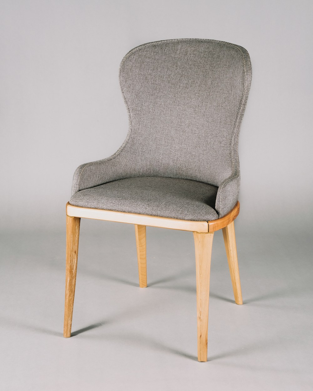 Chair inspiration showing upholstery, curved form and natural wooden legs